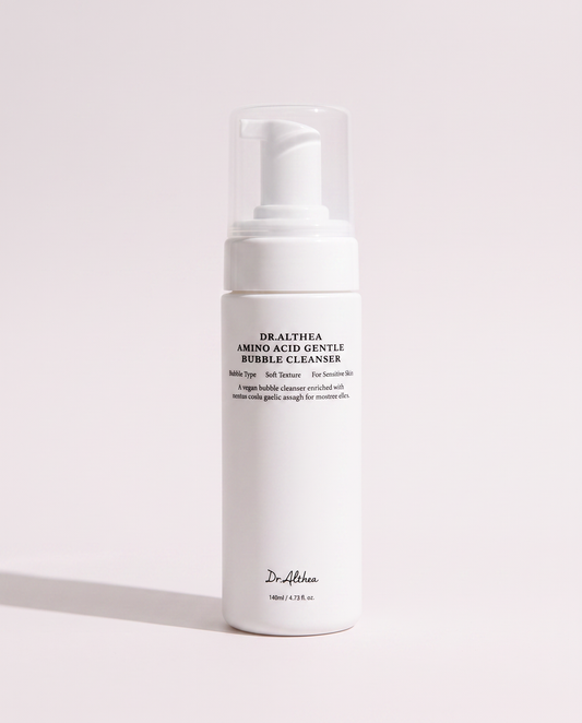 Dr.Althea Amino Acid Bubble Cleanser 140ml - white foaming pump bottle on a pale pink background