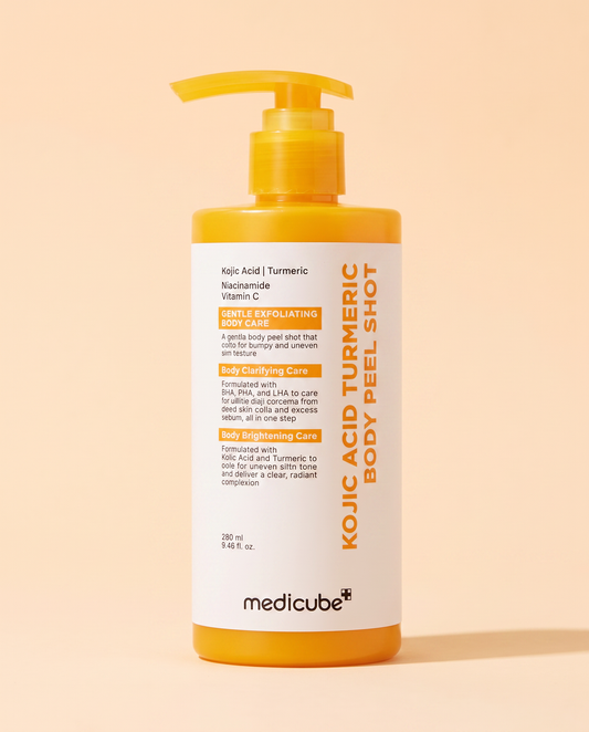 Medicube Kojic Acid Turmeric Body Peel Shot 280ml - yellow pump bottle, front label, on a peach background
