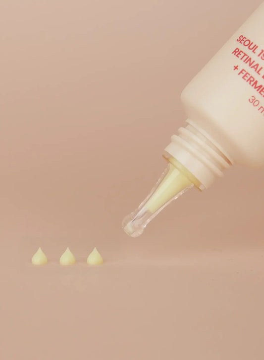 Seoul 1988 Retinal Liposome 4% Eye Cream 30ml - tube tip dispensing three drops of the pale serum