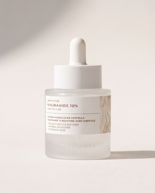 SKIN1004 Niacinamide 10% Boosting Ampoule 30ml - cream dropper bottle on a pale beige background