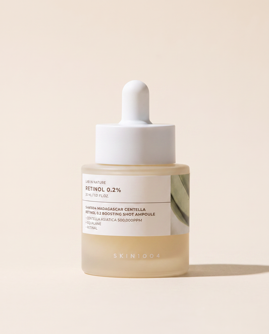 SKIN1004 Retinol 0.2% Boosting Ampoule 30ml - small cream bottle with a dropper on a beige background