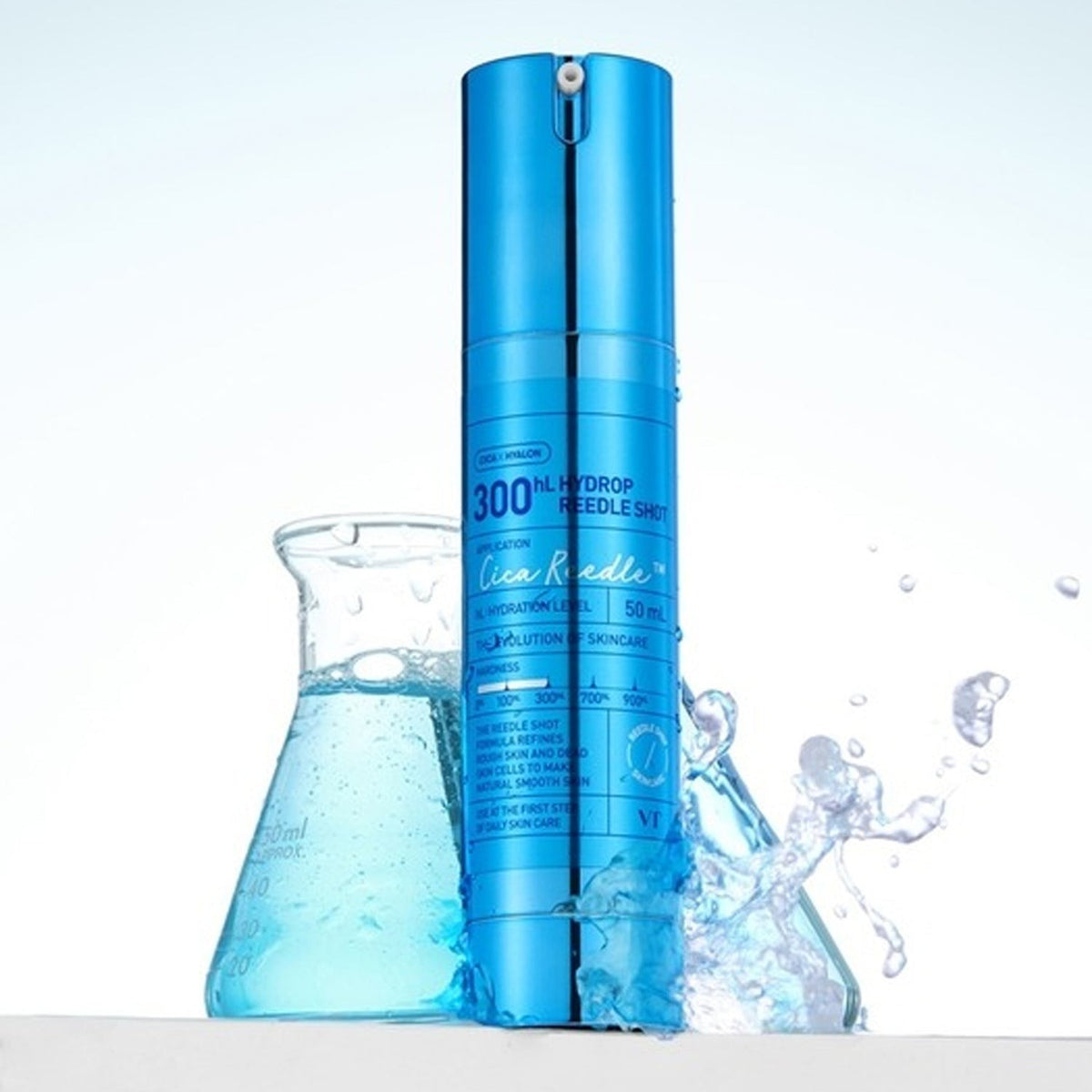 VT Cosmetics Hydrop Reedle Shot 300hL 50ml standing beside a beaker of splashing blue liquid on a white lab-style set