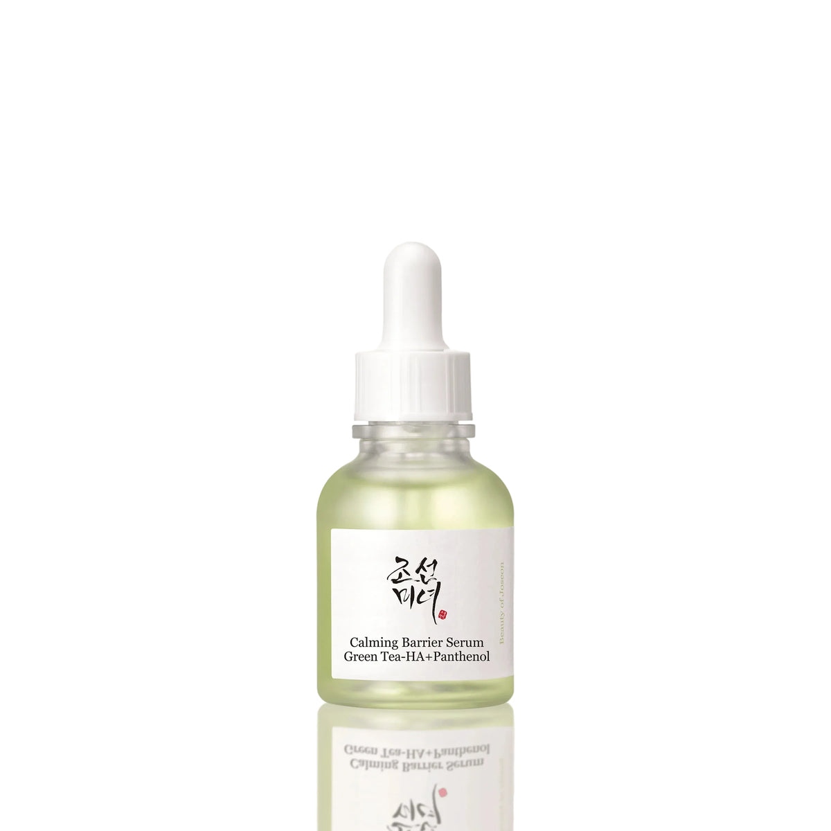 A glass dropper bottle of Calming Barrier Serum with green tea and panthenol, featuring a white label with Korean and English text, set against a clean off-white background with a soft reflection below.