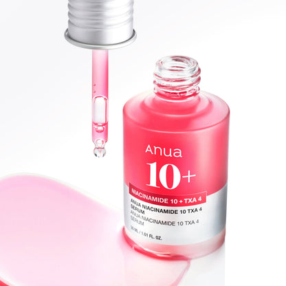 Anua Niacinamide 10% + TXA 4% Brightening Serum 30ml - pink bottle open with the dropper releasing a drop