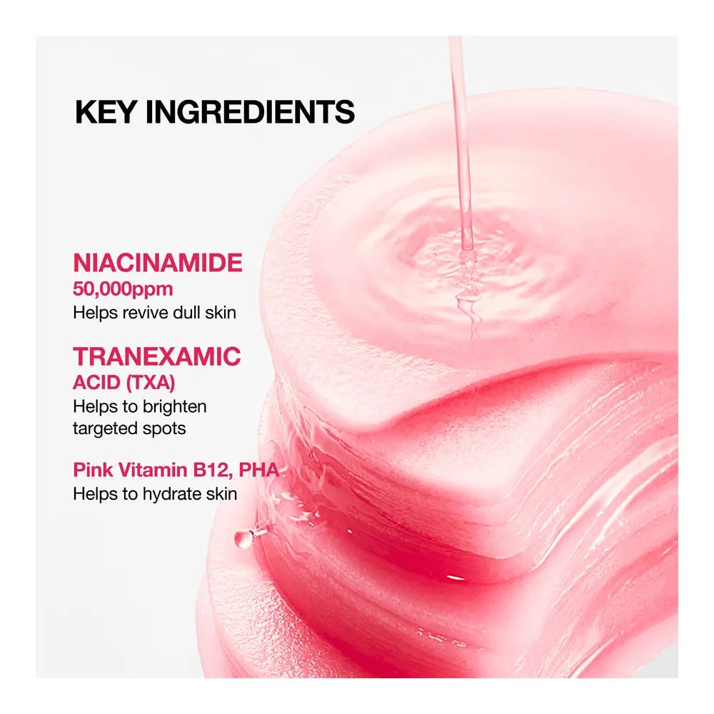 Key ingredients on a stack of pink pads: 50,000 ppm niacinamide, tranexamic acid, and pink vitamin B12 and PHA