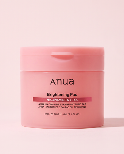 Anua Niacinamide 5% TXA Brightening Toner Pads 60 Pads - pink toner pad tub on a pink background