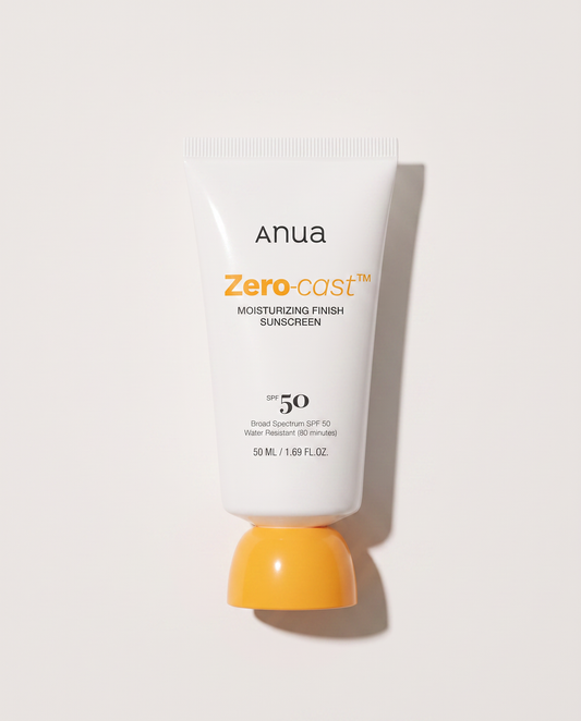 Anua Zero-Cast Sunscreen SPF50 50ml - sunscreen tube standing on its yellow cap, white background