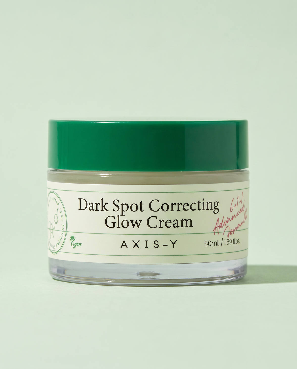 AXIS-Y Dark Spot Correcting Glow Cream 50ml - green-lidded jar on a pale green background