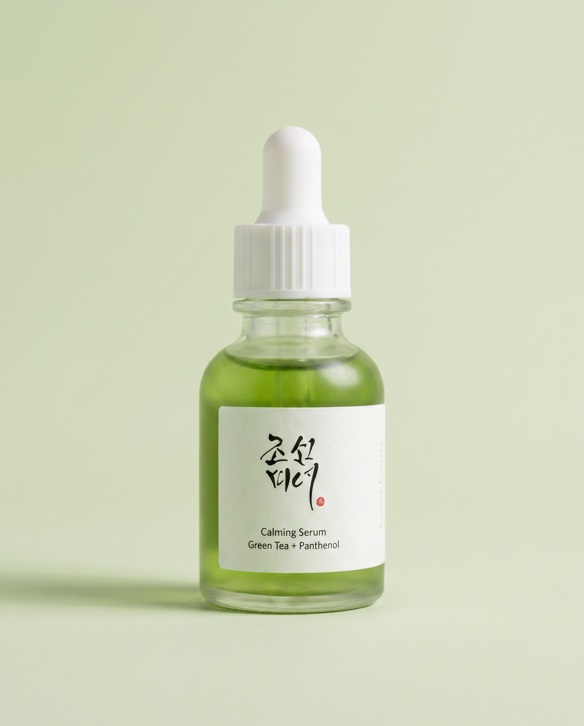 Beauty of Joseon Calming Serum Green Tea + Panthenol 30ml - green serum dropper bottle on a pale green background
