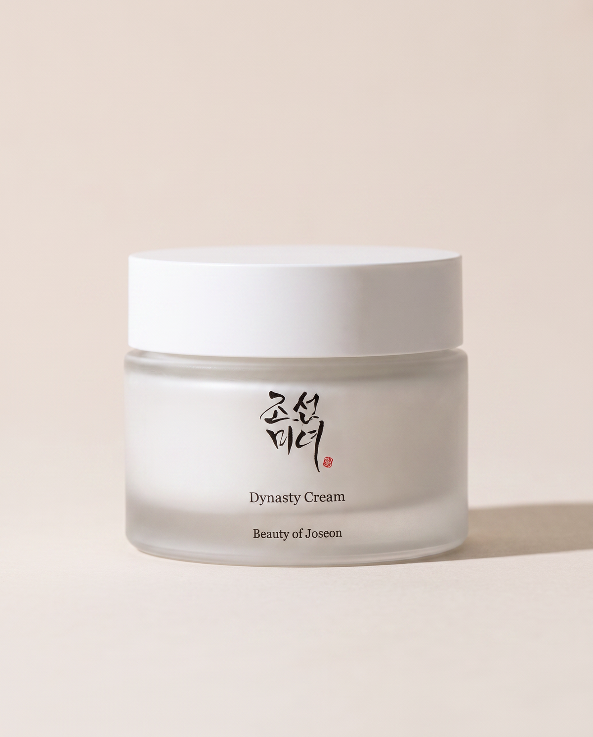 Beauty of Joseon Dynasty Cream 50ml - white cream jar, close crop, beige background