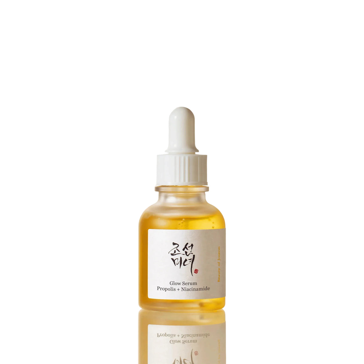 Beauty of Joseon Glow Serum Propolis + Niacinamide 30ml - amber dropper bottle on a cream background