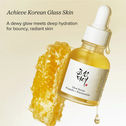 Beauty of Joseon Glow Serum Propolis + Niacinamide 30ml - amber dropper bottle beside a honeycomb, cream background