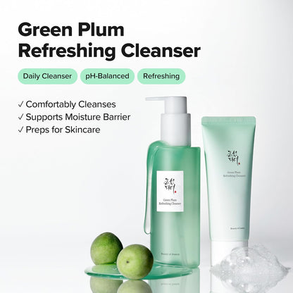 Green Plum Refreshing Cleanser pump bottle and tube beside green plums: a daily pH-balanced cleanser that supports the moisture barrier and preps for skincare