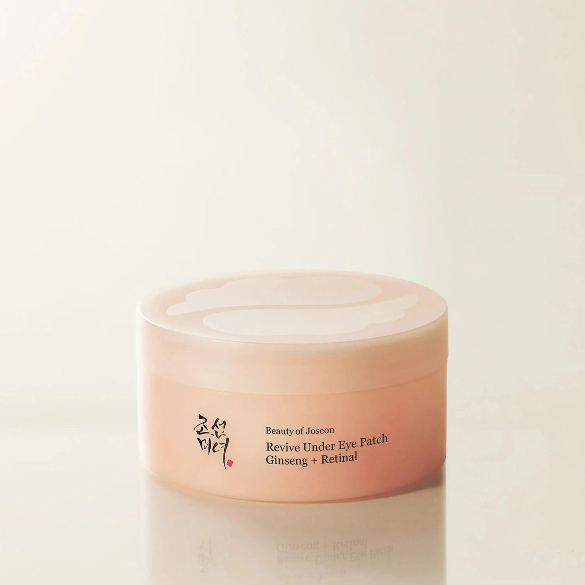 Beauty of Joseon Revive Eye Patch Ginseng + Retinal 60 Patches - pink eye patch jar on a cream background
