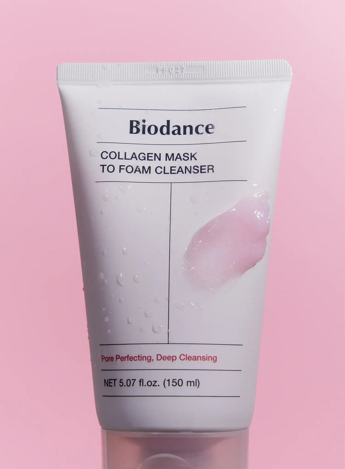 Biodance Collagen Mask To Foam Cleanser 150ml - pink tube with a swirl of the cleanser beside it, pink background