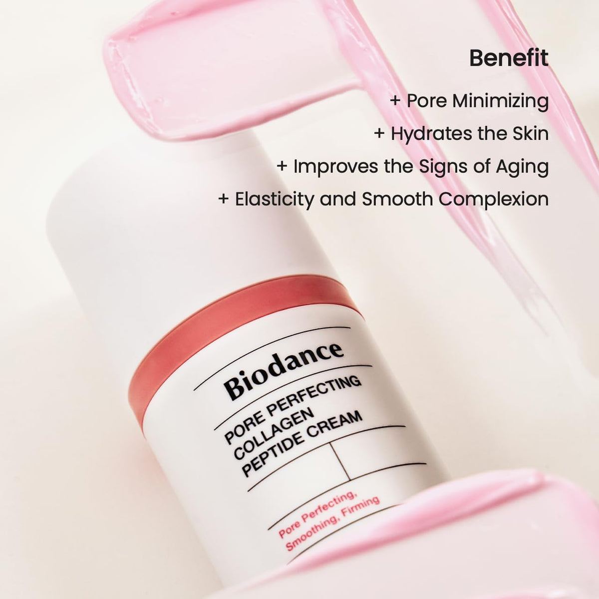 The bottle lying on a pink cream swipe with benefits: pore minimising, hydrates, improves signs of ageing, elasticity and a smooth complexion
