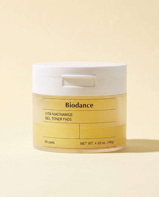 Biodance Vita Niacinamide Gel Toner Pads 60 Pads 140g - yellow jar on a cream background