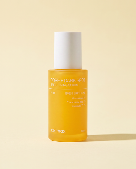 Celimax Pore+Dark Spot Brightening Serum 30ml - orange serum bottle, front label, cream background