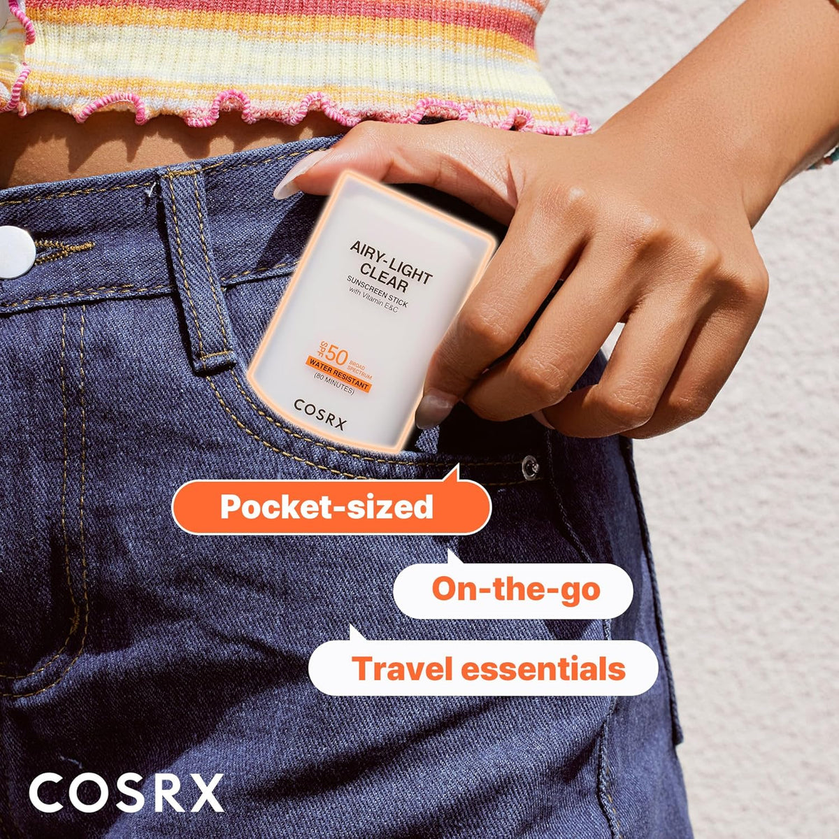 The sunscreen stick slipped into a jeans pocket: pocket-sized, on-the-go, travel essential