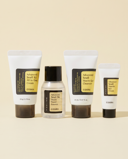 COSRX All About Snail Kit - the snail kit minis lined up on a cream background