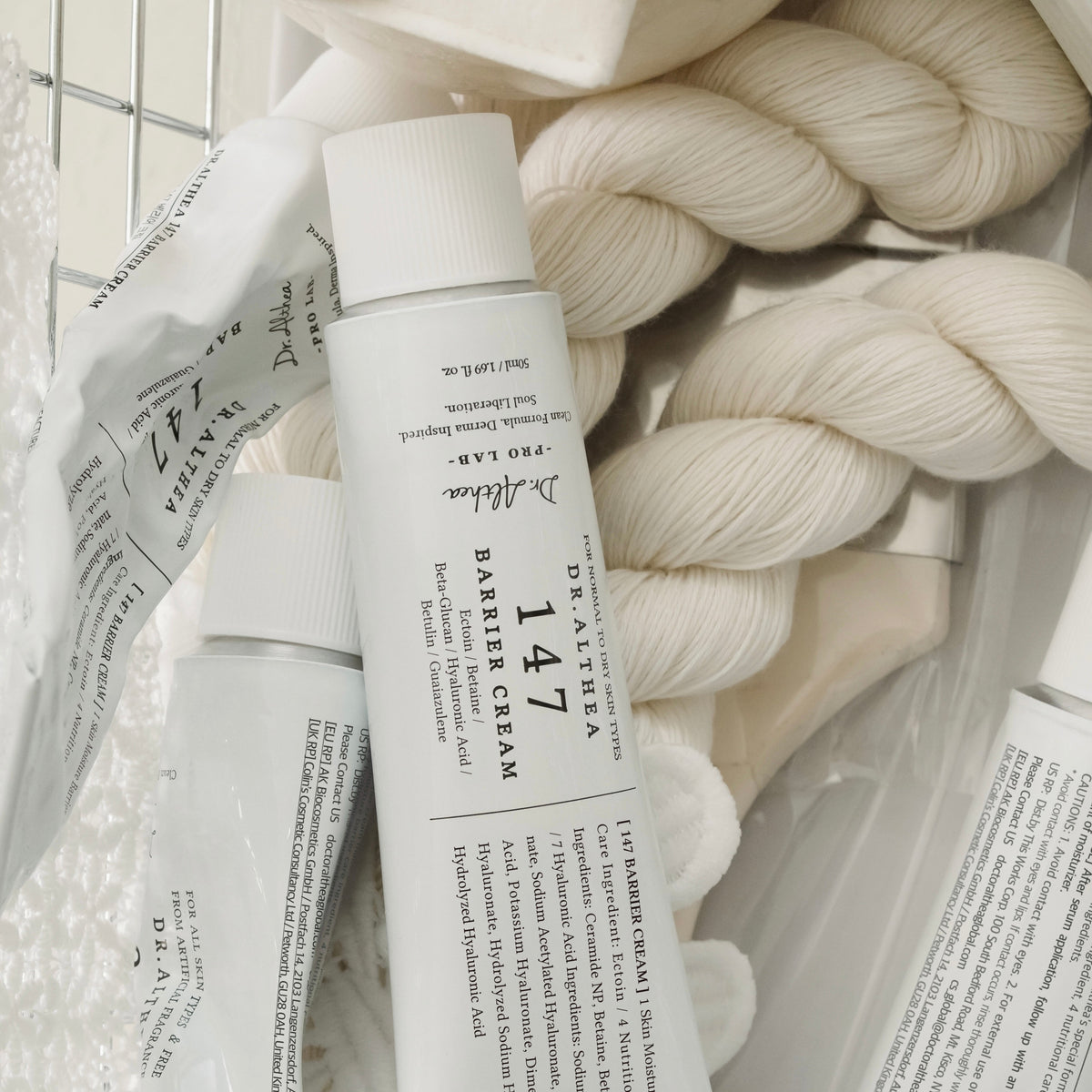 Dr.Althea 147 Barrier Cream 50ml - two tubes resting on soft white knitwear
