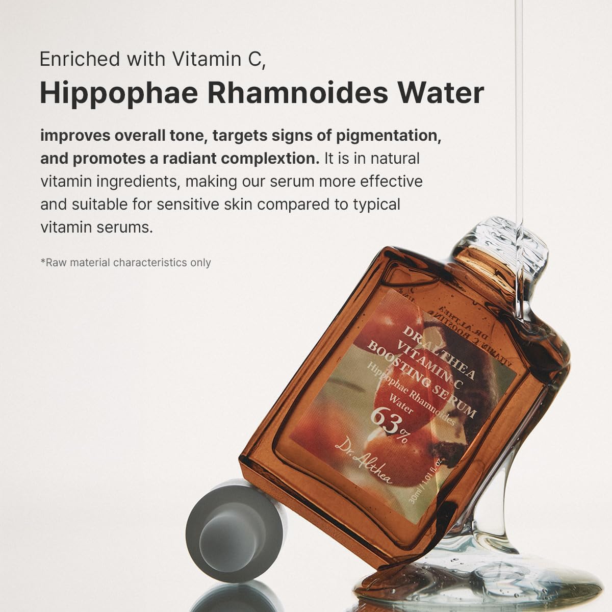 The Vitamin C Boosting Serum bottle lying with serum spilling: enriched with vitamin C and hippophae rhamnoides water for tone and pigmentation