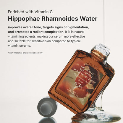 The Vitamin C Boosting Serum bottle lying with serum spilling: enriched with vitamin C and hippophae rhamnoides water for tone and pigmentation