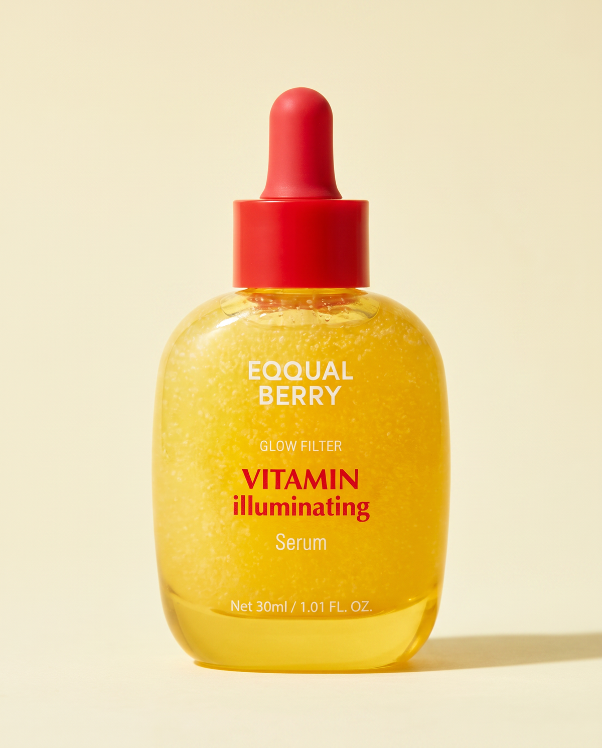 Eqqualberry Vitamin Illuminating Serum 30ml - yellow dropper bottle with a red cap on a warm beige background