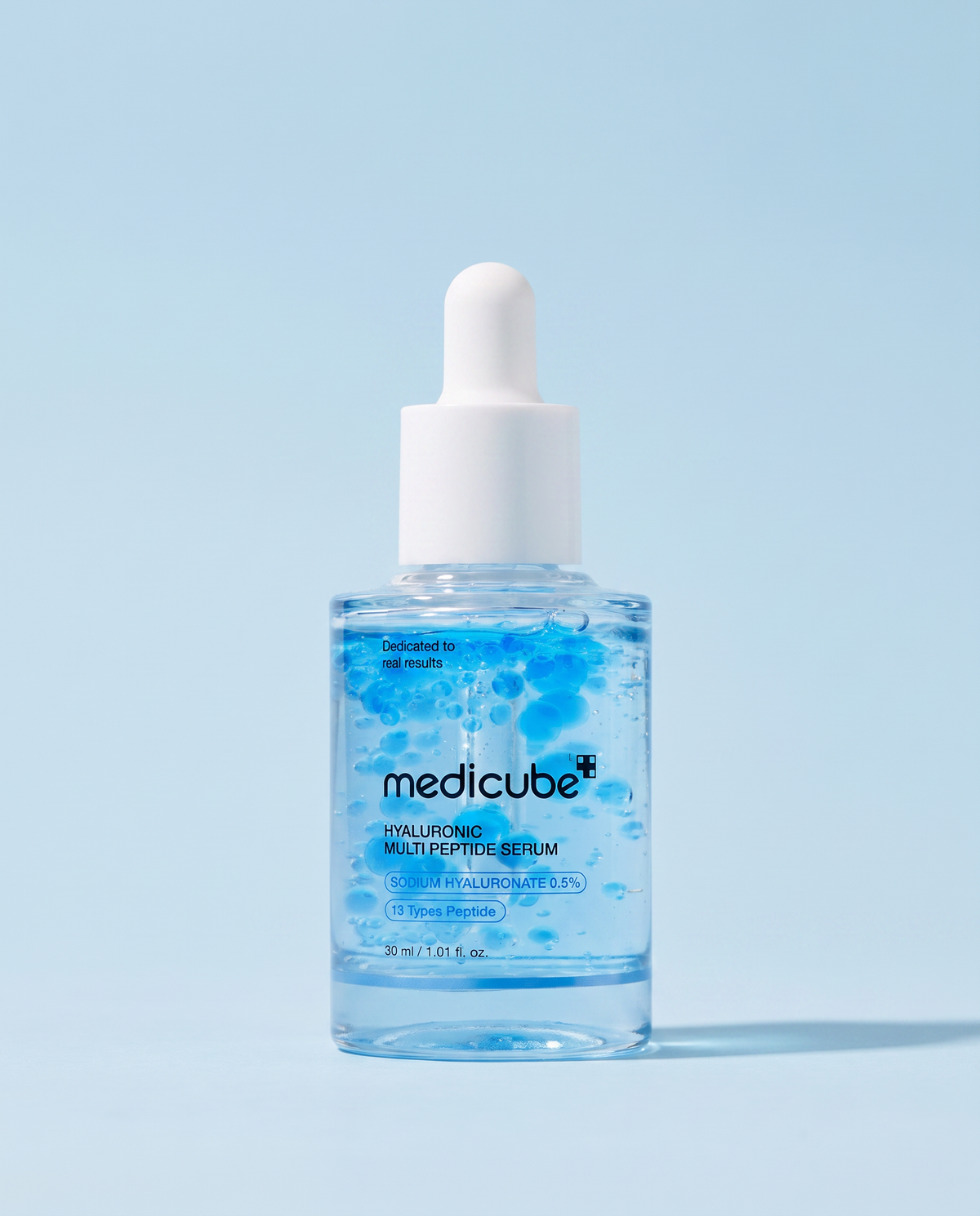 Medicube Hyaluronic Multi Peptide Serum 30ml - blue dropper bottle on a pale blue background