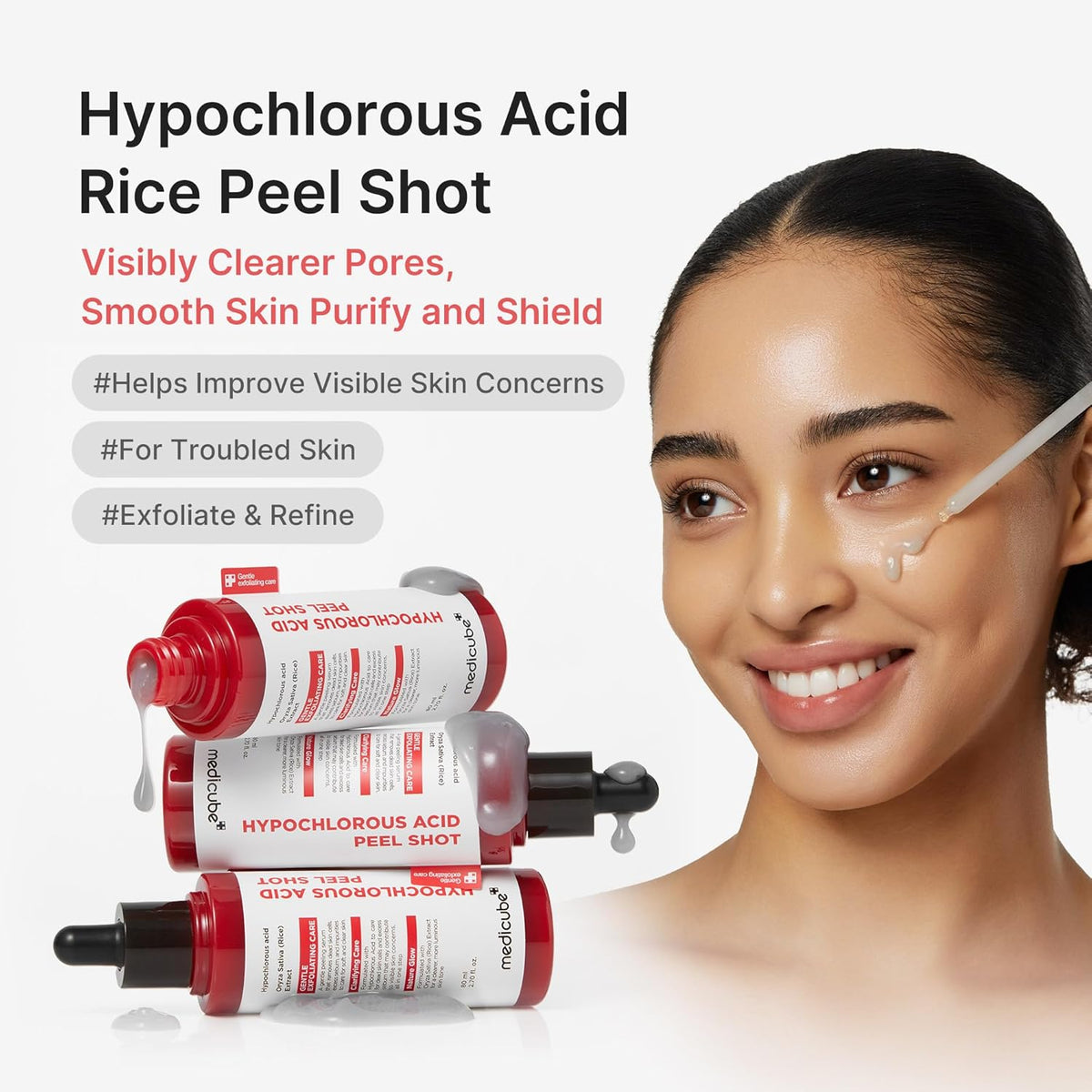 Hypochlorous Acid Rice Peel Shot beside a smiling model: visibly clearer pores, smooth skin, purify and shield, for troubled skin, exfoliate and refine