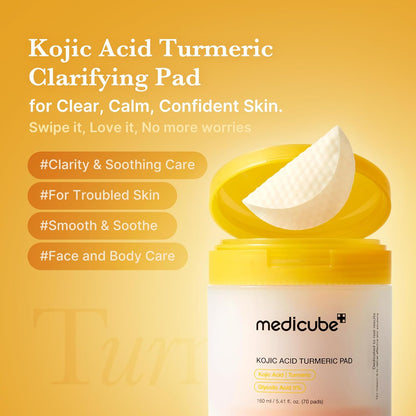 Kojic Acid Turmeric clarifying pad lifted from the open jar, tagged clarity and soothing care, for troubled skin, face and body