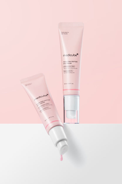 Medicube PDRN Pink Peptide Eye Cream 30ml - pink tube and pump bottle on a pink and white background
