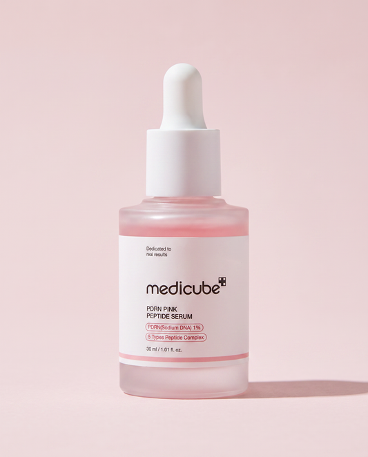 Medicube PDRN Pink Peptide Serum 30ml - pink dropper bottle on a pale pink background