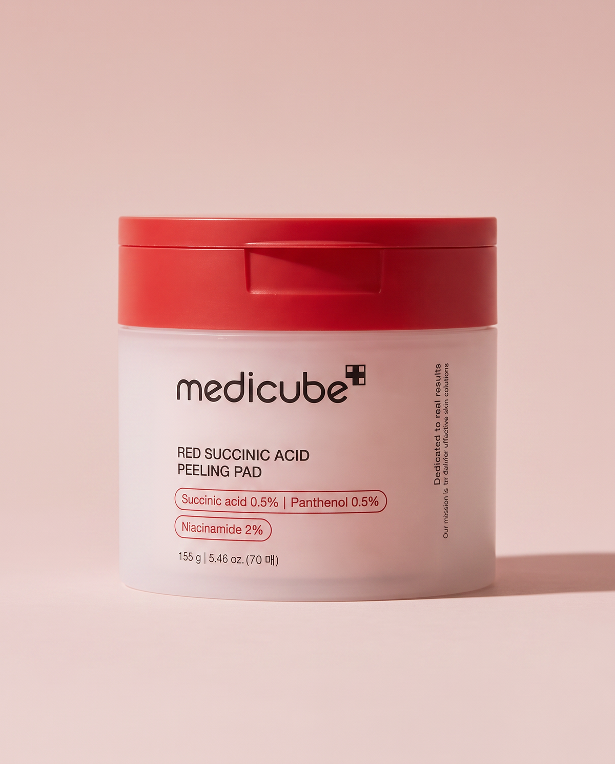 Medicube Red Succinic Acid Peeling Pad 70 Pads - white tub with a red lid on a pink background