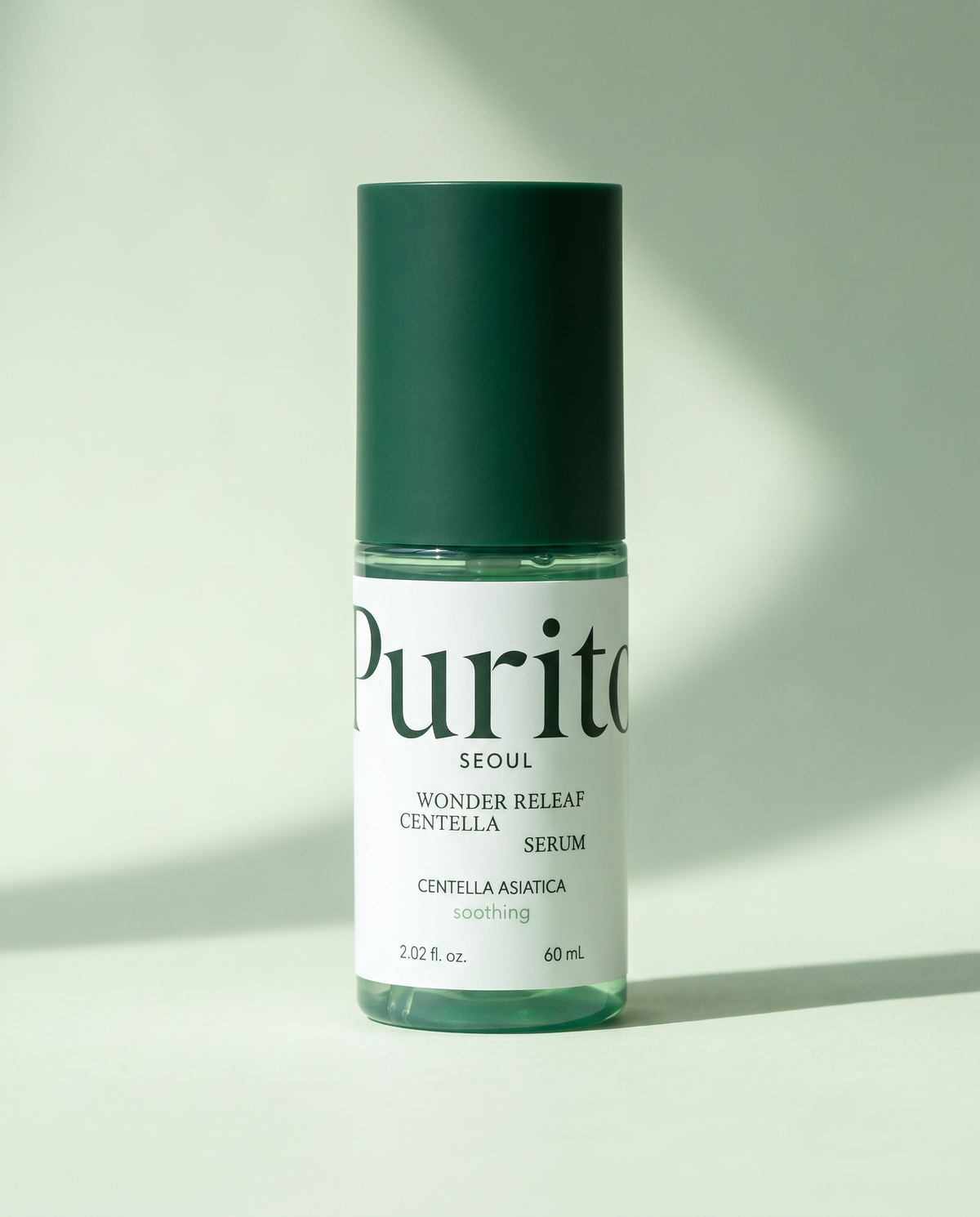 PURITO Wonder Releaf Centella Serum 60ml - dark green serum bottle on a pale green background