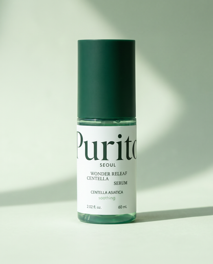 PURITO Wonder Releaf Centella Serum 60ml - dark green serum bottle on a pale green background