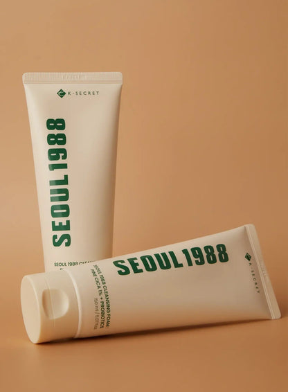 Seoul 1988 Pine Cica Cleansing Foam 150ml - two cream tubes leaning together on a tan background