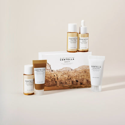 SKIN1004 Centella Travel Kit - travel kit arranged on a stone plinth, beige background