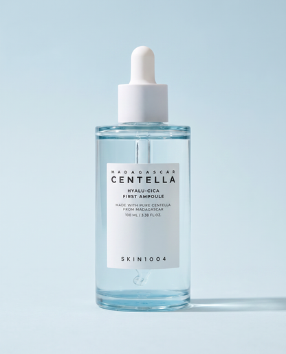 SKIN1004 Hyalu-Cica First Ampoule 100ml - clear ampoule bottle on a pale blue background