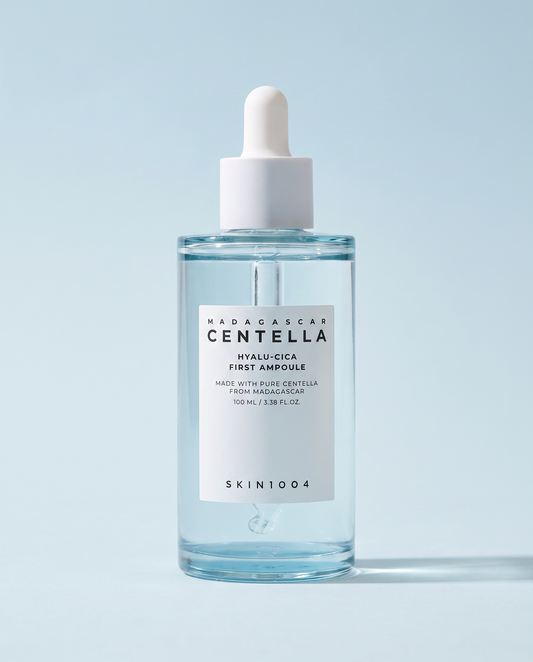 SKIN1004 Hyalu-Cica First Ampoule 100ml - clear ampoule bottle on a pale blue background