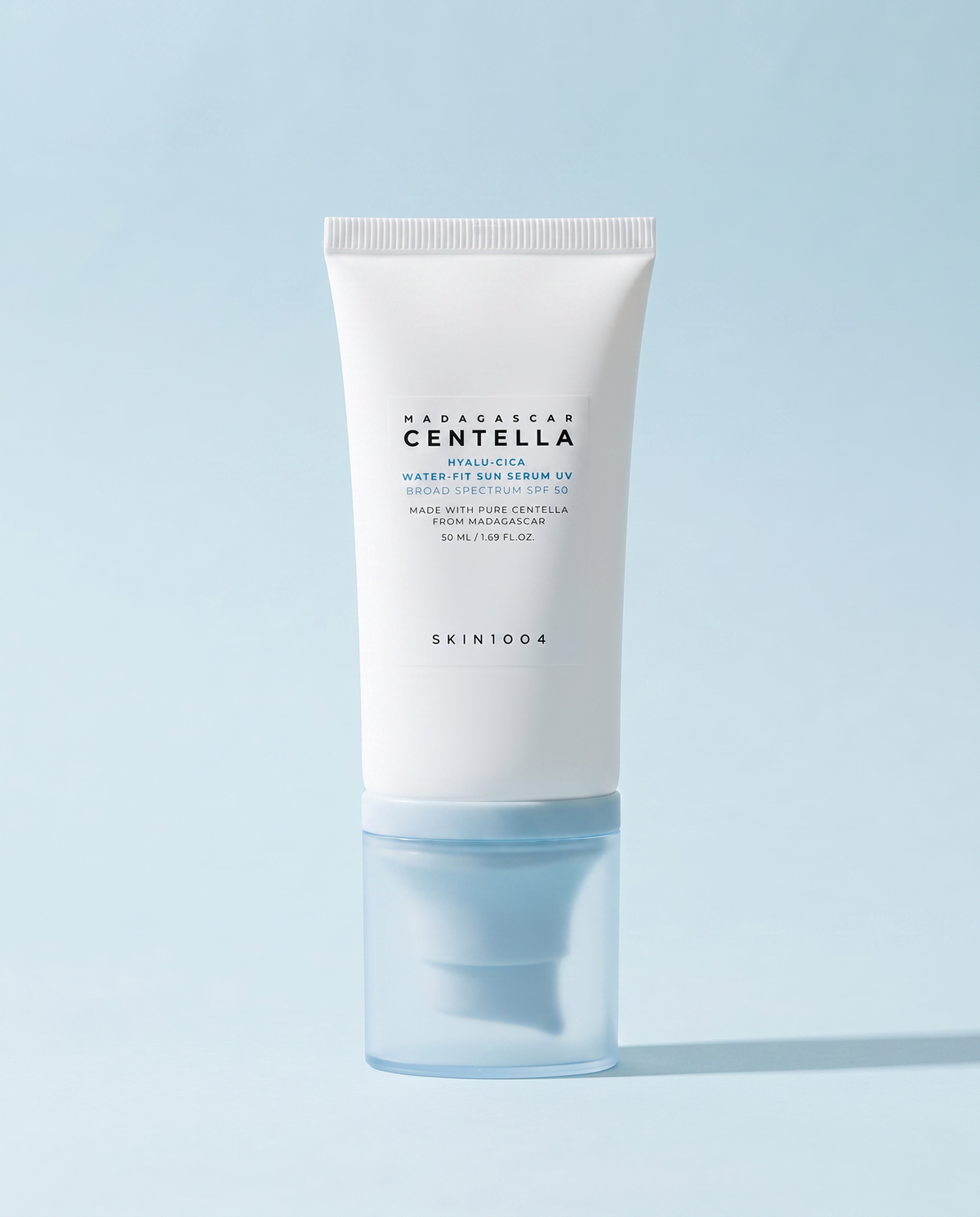 SKIN1004 Hyalu-Cica Water-Fit Sun Serum SPF50 50ml - white sunscreen tube on a pale blue background