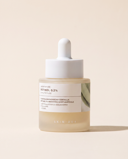 SKIN1004 Retinol 0.2% Boosting Ampoule 30ml - small cream bottle with a dropper on a beige background