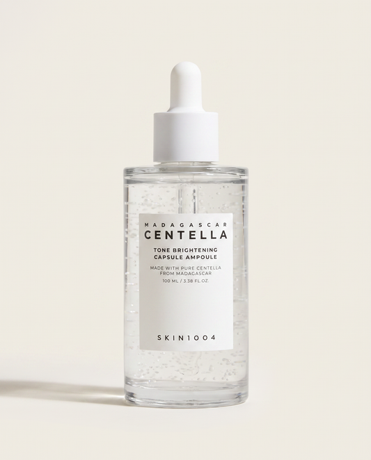 SKIN1004 Tone Brightening Capsule Ampoule 100ml - clear ampoule bottle on a cream background