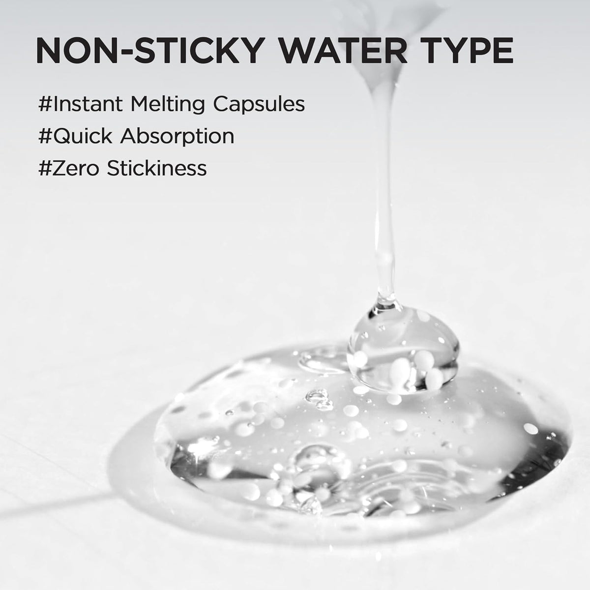 Non-sticky water type: a stream pouring into a puddle of clear ampoule with visible capsules, instant melting, quick absorption, zero stickiness