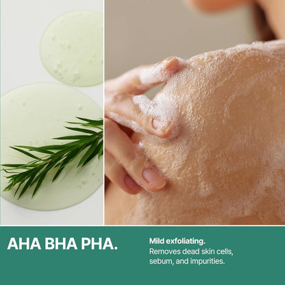 AHA BHA PHA: tea tree sprigs beside a lathered shoulder, mild exfoliation that removes dead skin cells, sebum and impurities