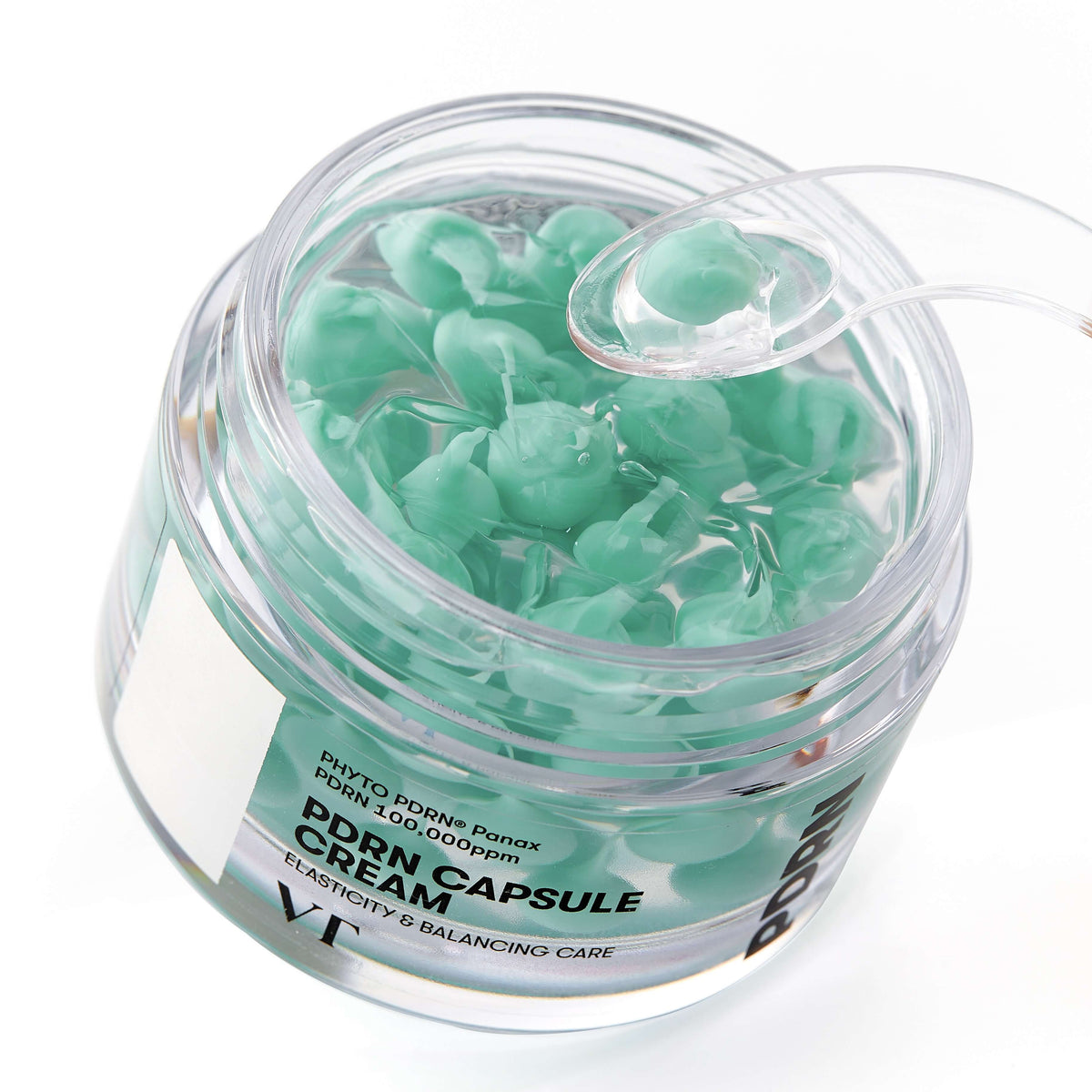 VT Cosmetics PDRN Capsule Cream 100 50ml - open jar of green capsules seen from above