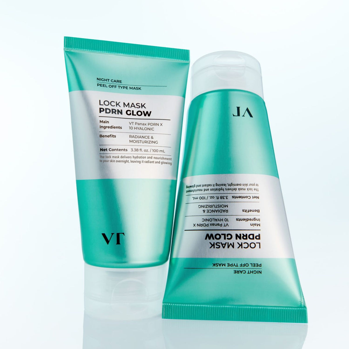 Two tubes of VT Cosmetics PDRN Glow Lock Mask 100ml, the night-care peel-off mask, standing on a pale aqua background